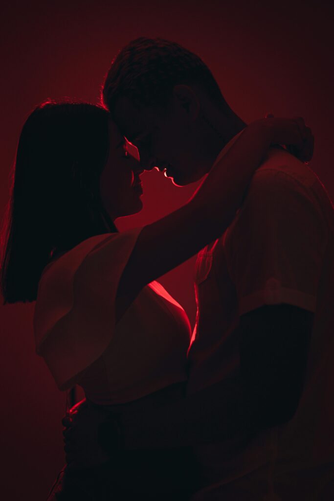 pexels photo 30373875 30373875 Silhouetted couple shares a tender embrace under warm, intimate lighting.