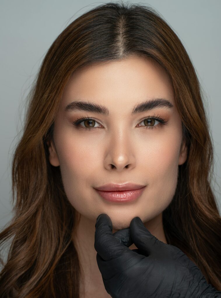 Close-up portrait of a woman with flawless skin, showcasing beauty and skincare.